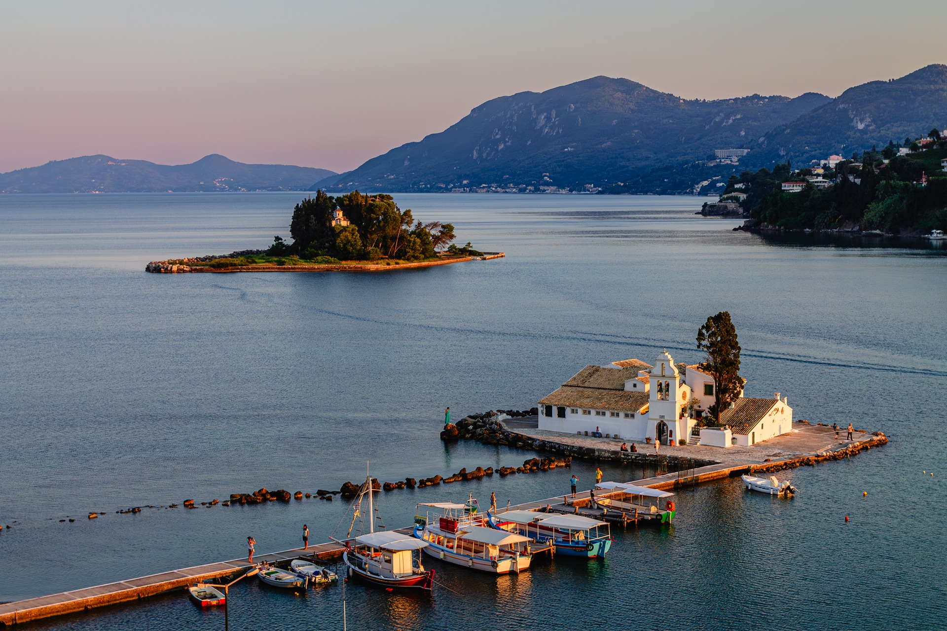 Vlacherna Monastery on Mouse Island on Corfu with Perama in the background