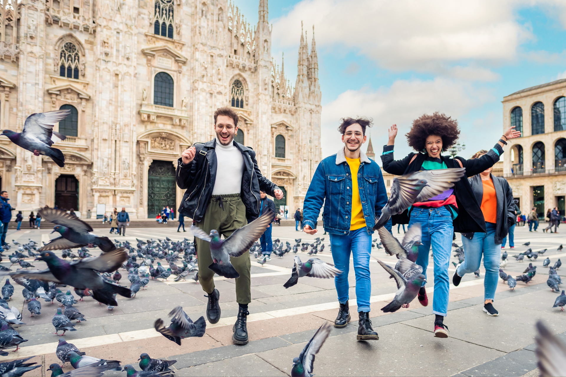 Tourists in Milan chasing Pigeons