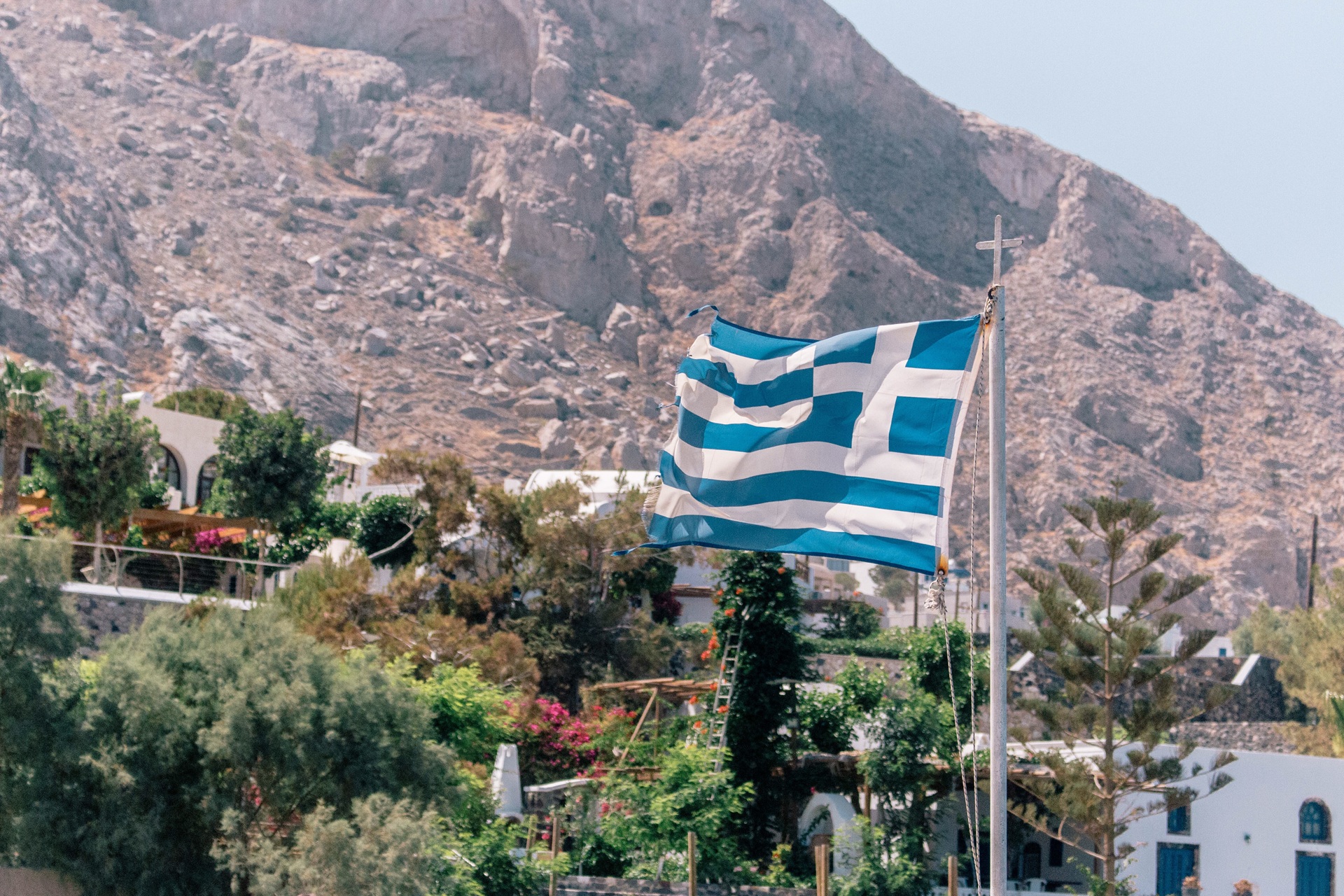 Greek Flag flying overnight Santorini countryside
